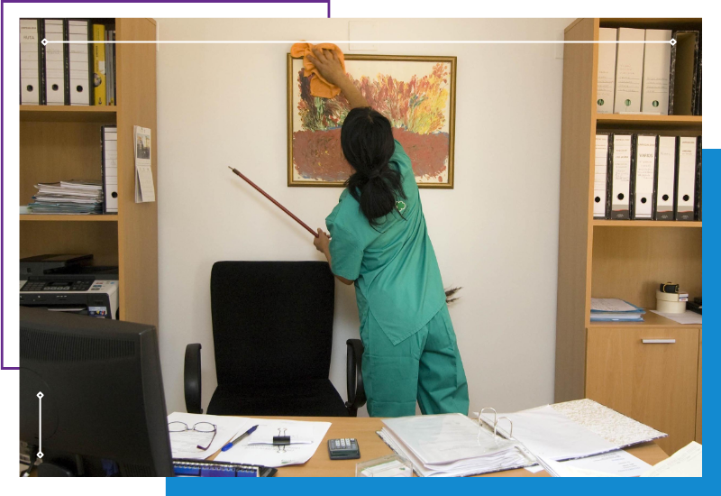 woman dusting a picture